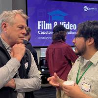 Two event attendees in conversation